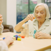 senior woman stacking blocks