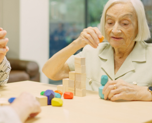 senior woman stacking blocks